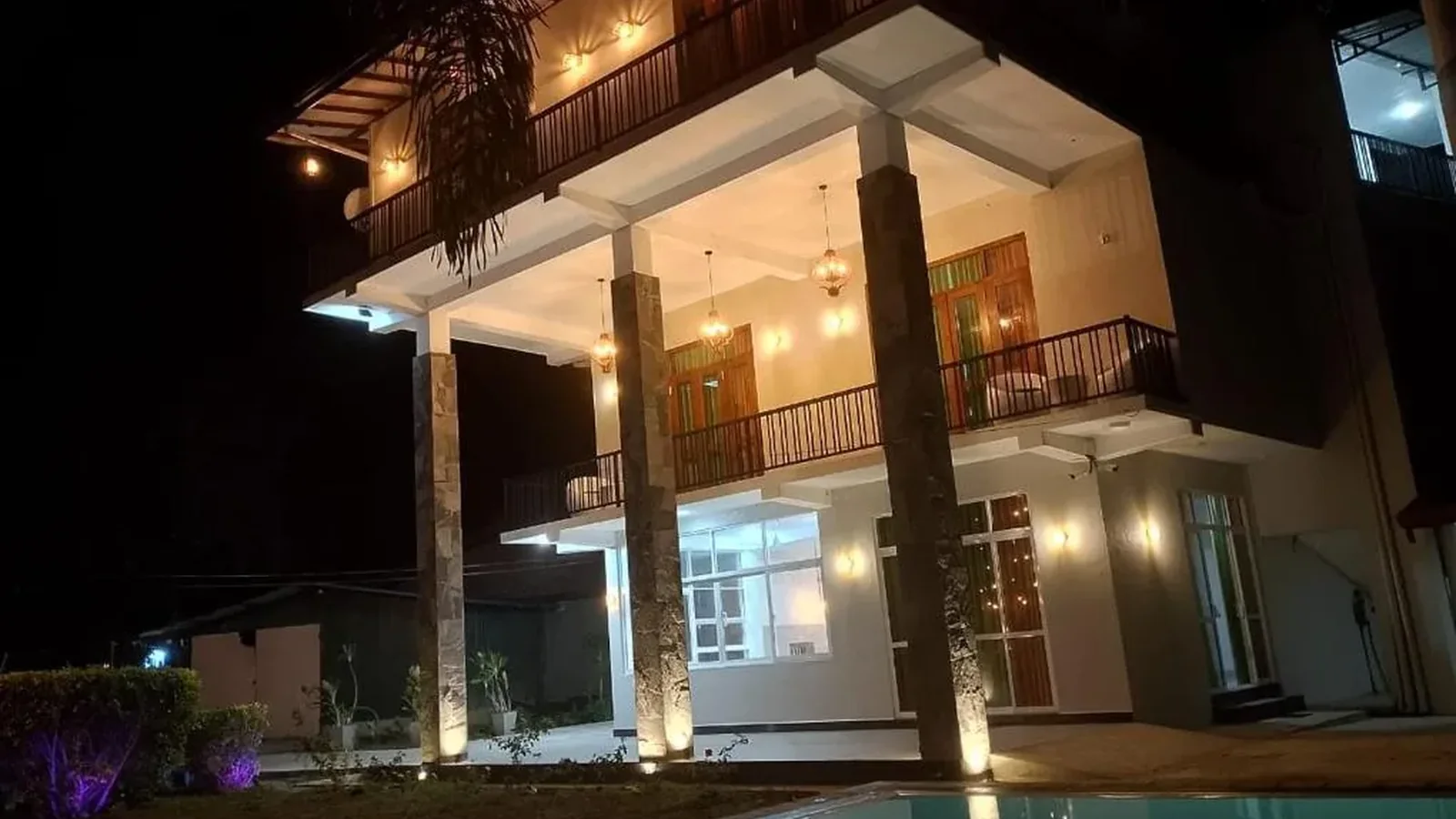 Malindu Yala Gate hotel and pool at night
