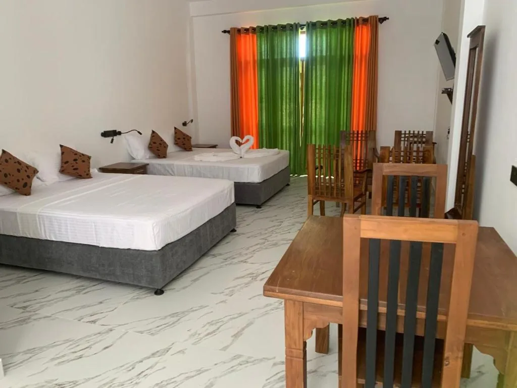 Wide room view with family sleeping arrangement and dining table
